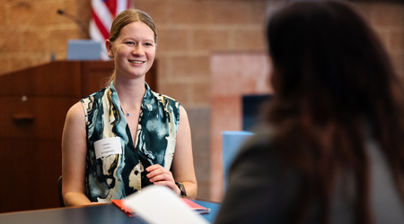 Student attending mock and mingle practicing interview skills with an employer